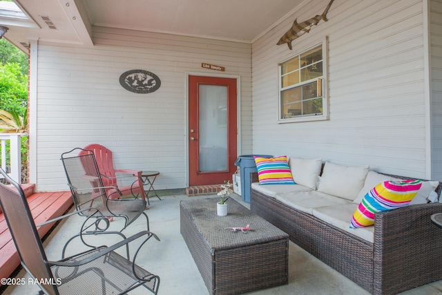 view of patio featuring an outdoor living space and visible vents