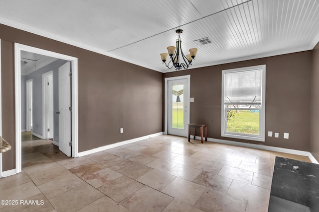 empty room featuring a notable chandelier, crown molding, baseboards, and visible vents