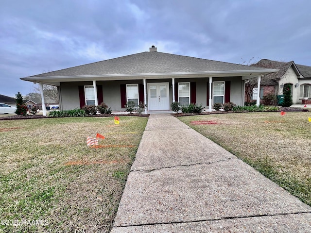 single story home featuring a front lawn and covered porch