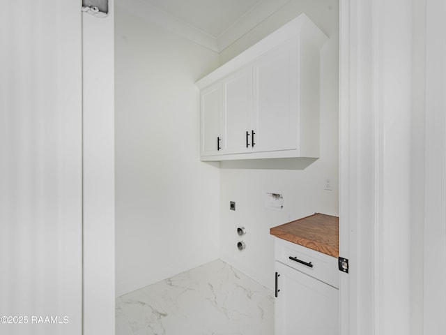 clothes washing area featuring crown molding, cabinets, hookup for an electric dryer, and hookup for a washing machine