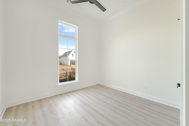 spare room with crown molding, light hardwood / wood-style flooring, and ceiling fan