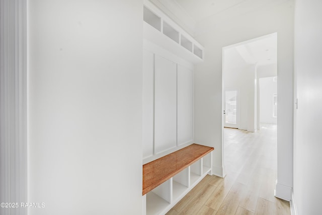 mudroom with light hardwood / wood-style floors