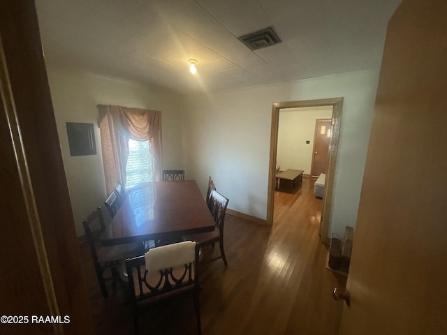 dining room with hardwood / wood-style flooring