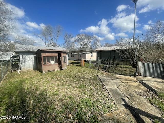 rear view of house with a yard