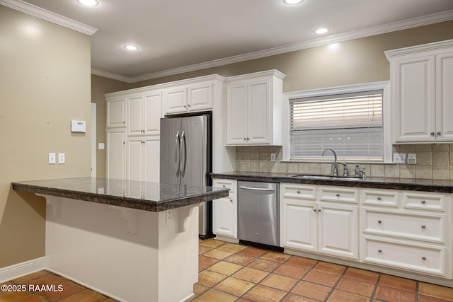 kitchen featuring a sink, appliances with stainless steel finishes, and white cabinetry