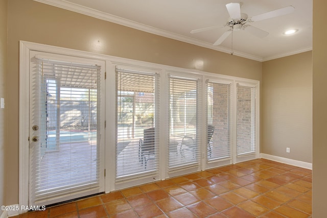 doorway with baseboards, ornamental molding, a ceiling fan, and tile patterned flooring