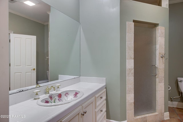 bathroom featuring a stall shower, toilet, ornamental molding, and vanity