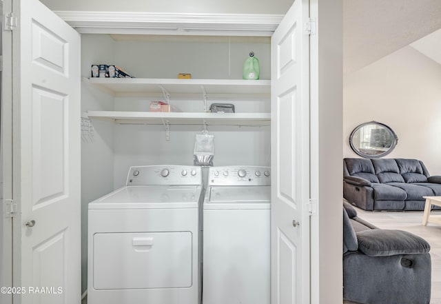 laundry room featuring washing machine and clothes dryer