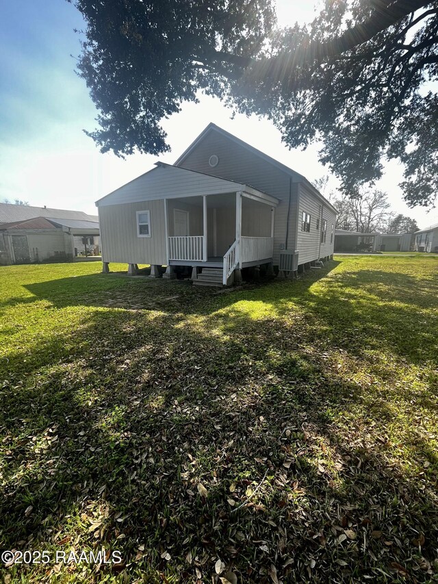 back of house with a yard