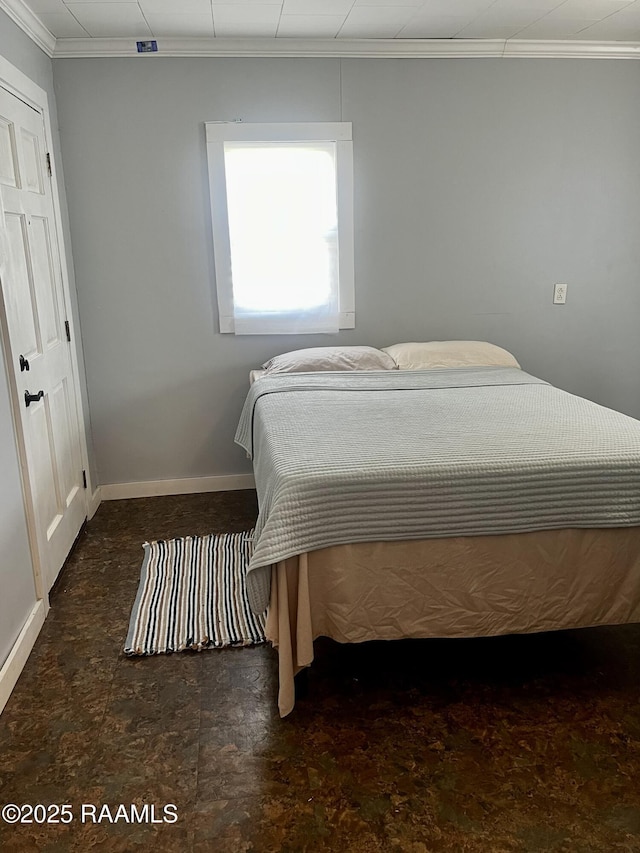 bedroom with crown molding