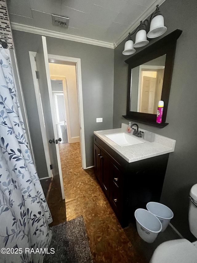 bathroom with crown molding, vanity, toilet, and a shower with shower curtain