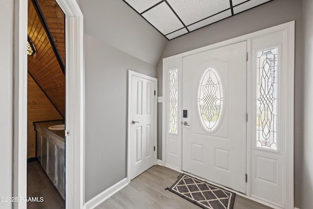 entryway featuring a paneled ceiling and light hardwood / wood-style floors