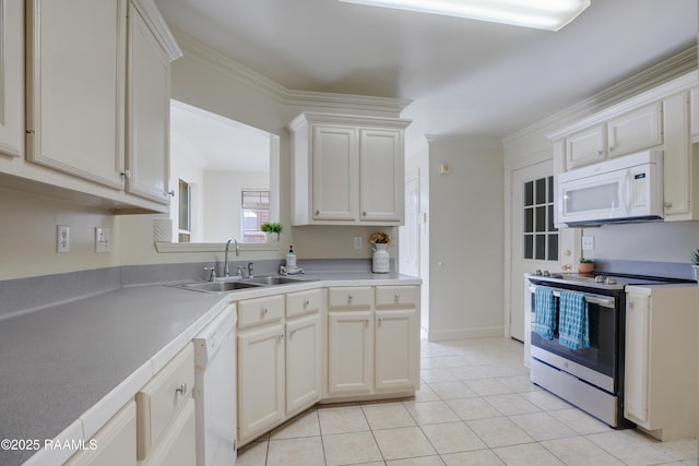 kitchen with sink, white appliances, and white cabinets