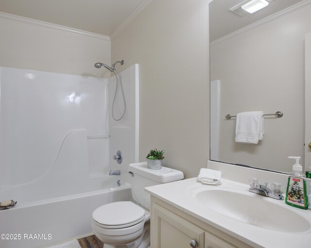 full bathroom featuring bathtub / shower combination, ornamental molding, toilet, and vanity