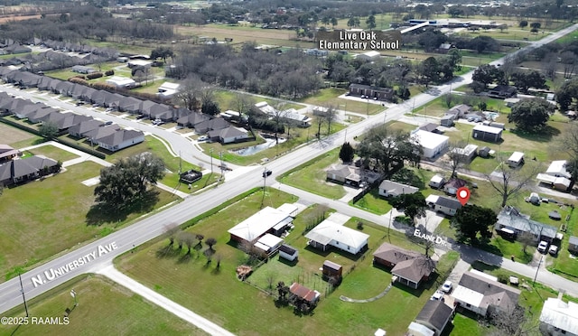 birds eye view of property with a residential view