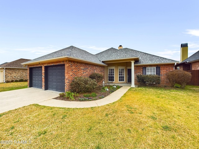 view of front of property featuring a garage and a front yard