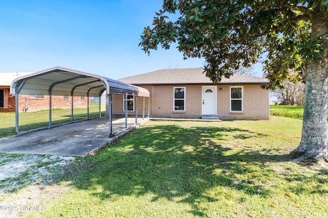 ranch-style home with a front yard and a carport