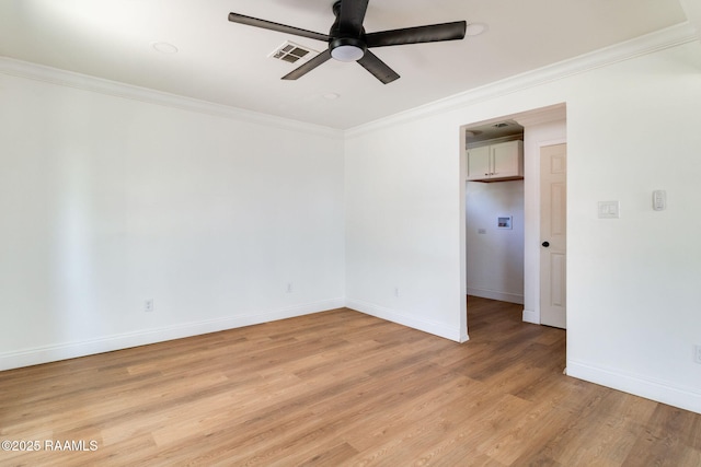 empty room featuring crown molding, ceiling fan, and light wood-type flooring