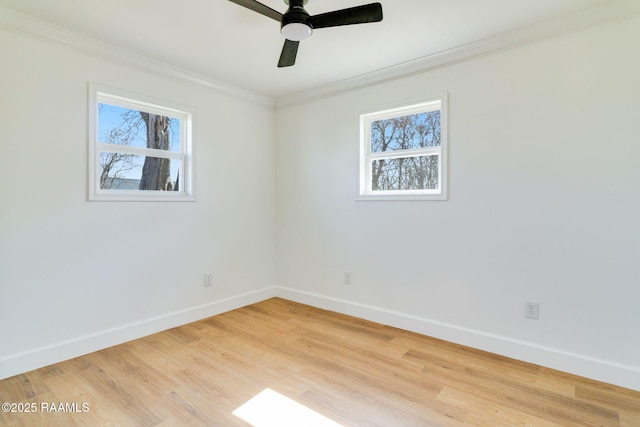 unfurnished room with crown molding and plenty of natural light