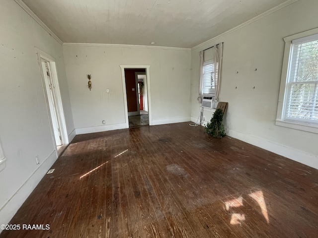 unfurnished living room with crown molding, baseboards, and wood-type flooring