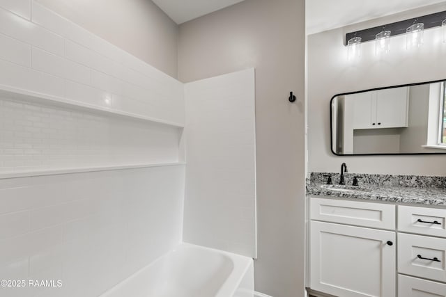 bathroom featuring vanity and shower / bathing tub combination