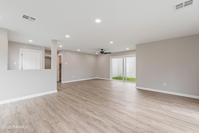 unfurnished room featuring ceiling fan and light hardwood / wood-style flooring