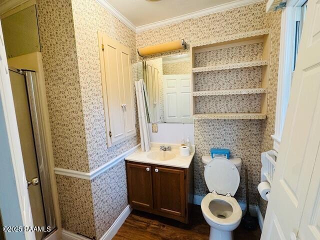 bathroom with wallpapered walls, a stall shower, wainscoting, wood finished floors, and crown molding