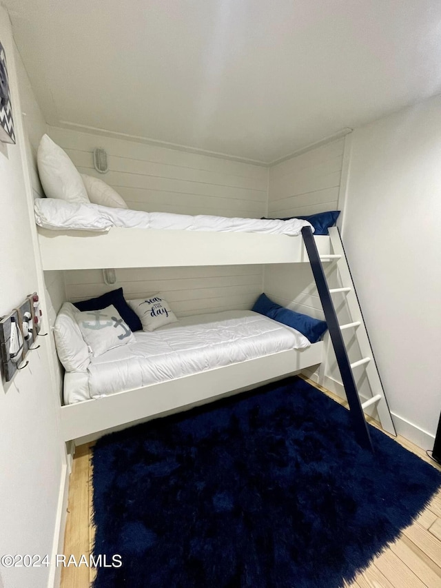 bedroom with wood-type flooring