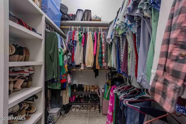 spacious closet featuring tile patterned floors