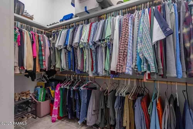 spacious closet featuring tile patterned floors