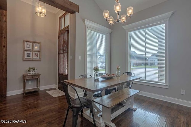 dining room featuring a notable chandelier, baseboards, and dark wood-style flooring