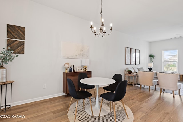 dining area with a chandelier and hardwood / wood-style floors