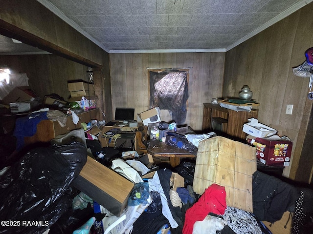 miscellaneous room with ornamental molding and wooden walls