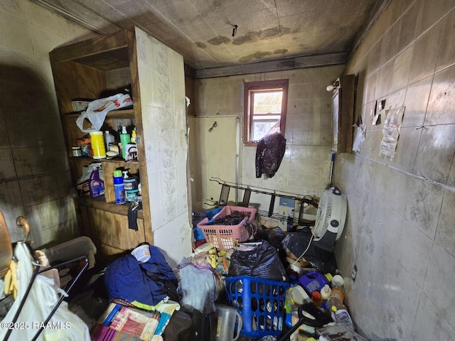 interior space with tile walls