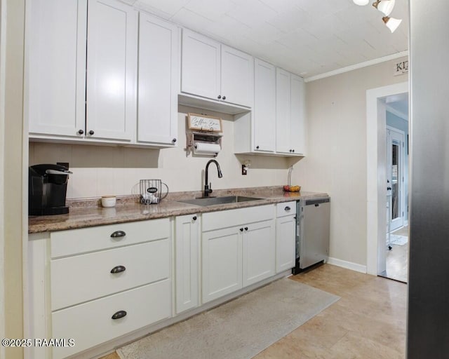 kitchen featuring sink, crown molding, stainless steel dishwasher, and white cabinets