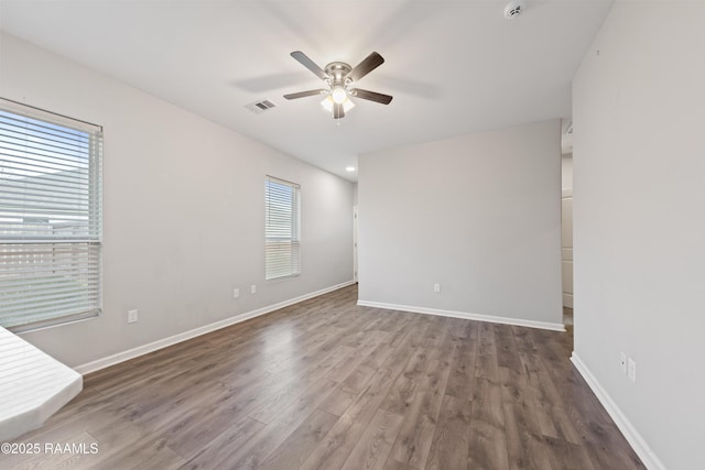 unfurnished room featuring ceiling fan and wood-type flooring