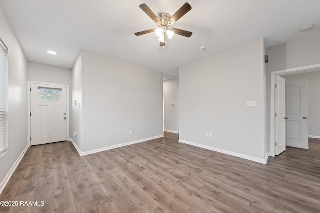 interior space with ceiling fan and light hardwood / wood-style floors