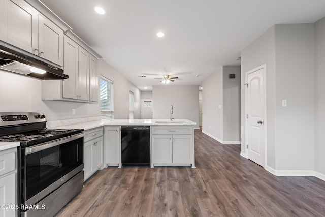 kitchen featuring kitchen peninsula, black dishwasher, sink, stainless steel electric range oven, and dark hardwood / wood-style floors