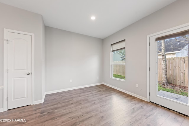 unfurnished room featuring light hardwood / wood-style flooring