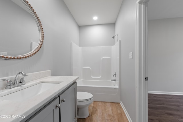 full bathroom featuring toilet, vanity, shower / bathing tub combination, and wood-type flooring