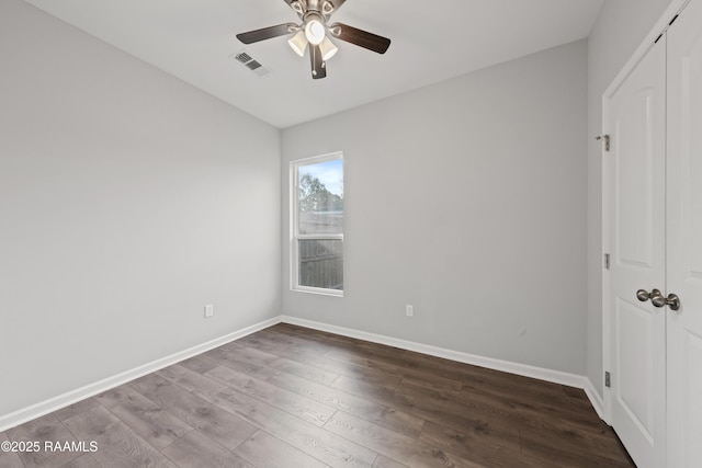 unfurnished bedroom featuring a closet, hardwood / wood-style flooring, and ceiling fan