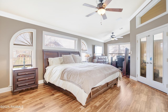 bedroom with french doors, lofted ceiling, crown molding, ceiling fan, and light hardwood / wood-style floors