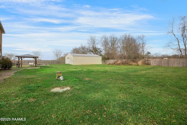 view of yard featuring a gazebo and an outdoor structure