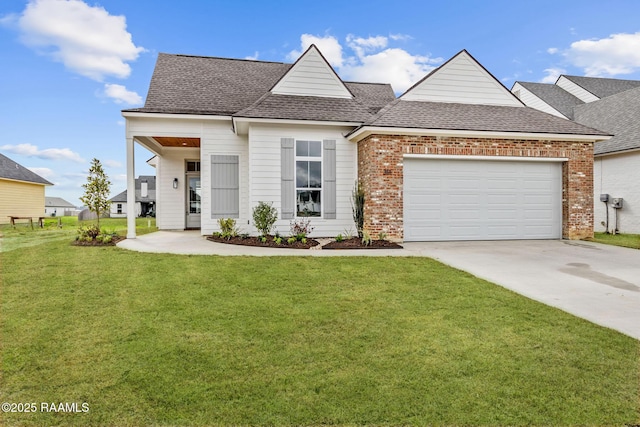 view of front of property featuring brick siding, a shingled roof, a front yard, a garage, and driveway