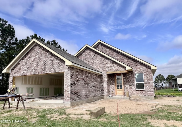 back of house with a patio area