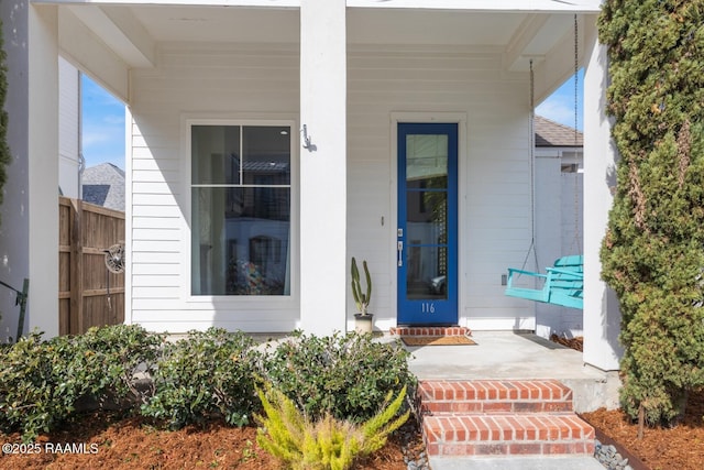 property entrance with covered porch