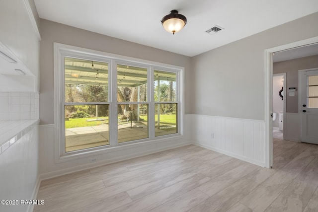 unfurnished room featuring light hardwood / wood-style floors