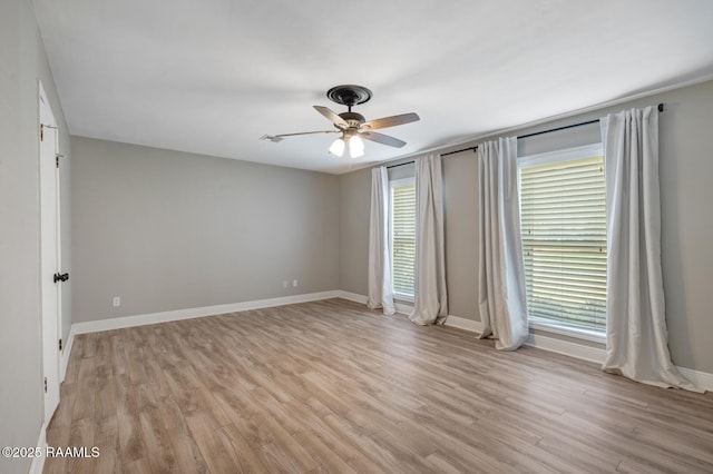 spare room with ceiling fan and light hardwood / wood-style floors