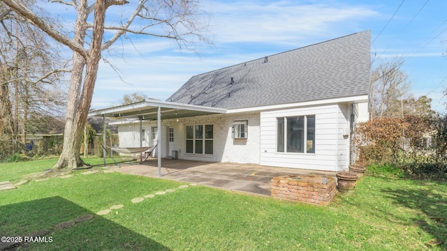 back of house with a patio and a yard