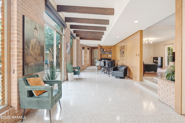 interior space featuring bar, light speckled floor, beam ceiling, and recessed lighting